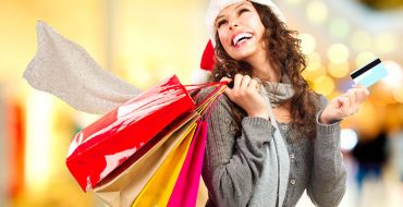 Christmas Shopping. Girl With Credit Card In Shopping Mall